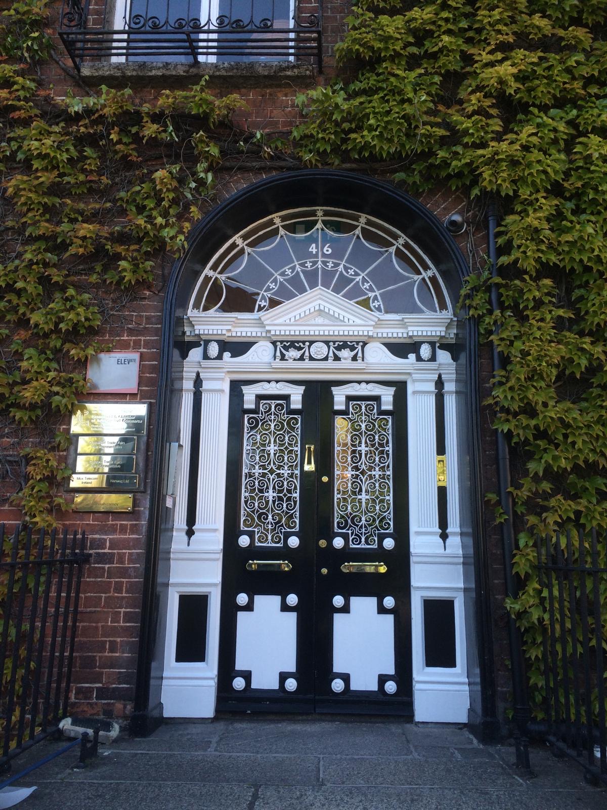 Restored Georgian entrance with detailed painted joinery