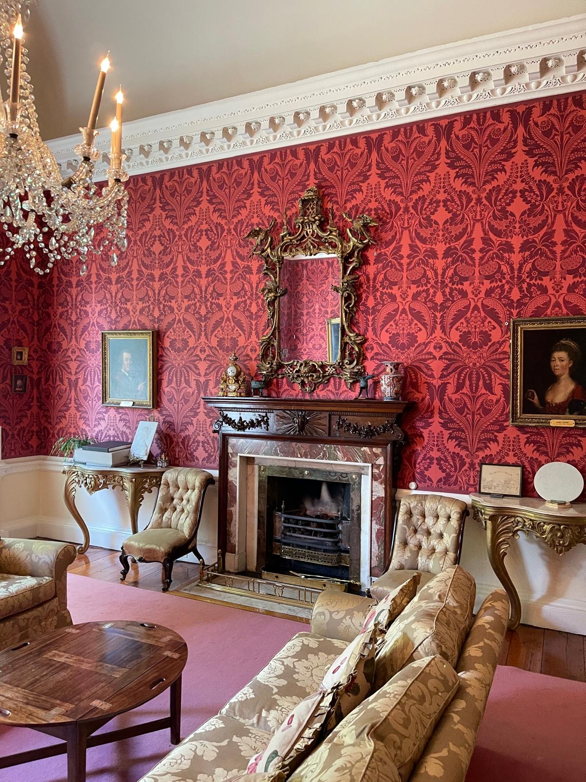Heritage room with decorative wall coverings and detailed cornice
